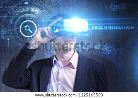 Business, Technology, Internet and network concept. Young businessman working in virtual reality glasses sees the inscription: Recommendation