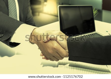 Business partnership meeting concept. Image businesspeople handshake. Successful businessmen handshaking after good deal. Horizontal, blurred