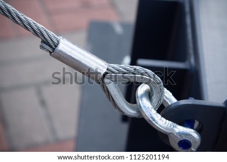 Swivel joint and connection with a steel cable when installing the structures outdoor close-up Royalty-Free Stock Photo #1125201194