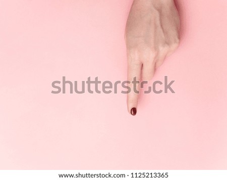 Hand finger guide pointing isolated on pink color background