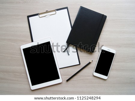 Flat lay stylish mockup photo with laptop, blank paper, pencil, mobile phone and black notebook on the light wooden table background. Stock photo for blog and website.