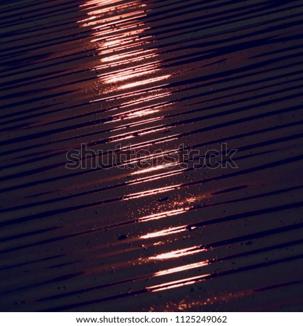 Beautiful blurry sunlight reflection in water of a pond unique photograph