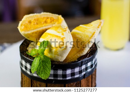 Traditional fresh empanadas on a wooden table