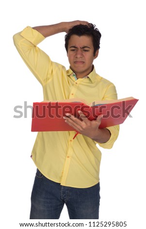 Student holding a book and he remembered something he did not write it on the exam so he hit his forehead with his hand, isolated on white background