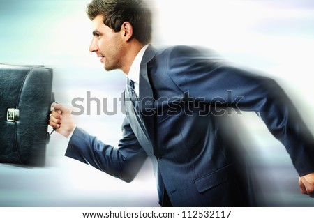 Portrait of businessman hurrying somewhere Royalty-Free Stock Photo #112532117