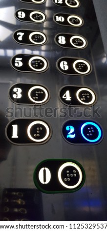 An elevator  is a type of vertical transportation that moves people or goods between floors of a building, vessel, or other structure. 