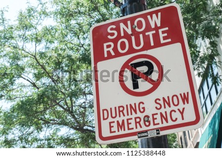 Street Sign Snow Route During Snow Emergency Royalty-Free Stock Photo #1125388448