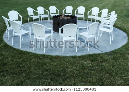 Fire Pit With A Cirlce Of Chairs For Vacation Royalty-Free Stock Photo #1125388481