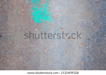 Rusty metal surface texture and background, there is a green paint
