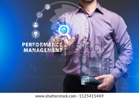 Business, Technology, Internet and network concept. Young businessman working on a virtual screen of the future and sees the inscription: Performance management