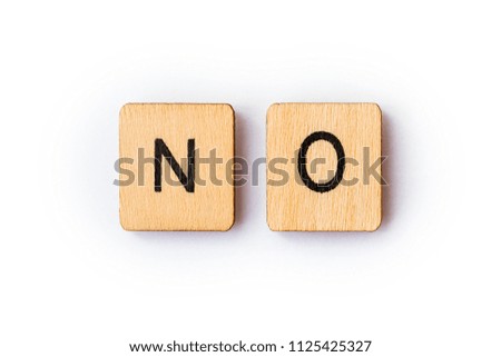 The word NO, spelt with wooden letter tiles