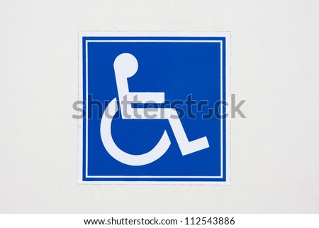 disabled people / international symbol of access on a wall