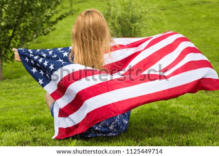 Young woman with american flag ,4th of july