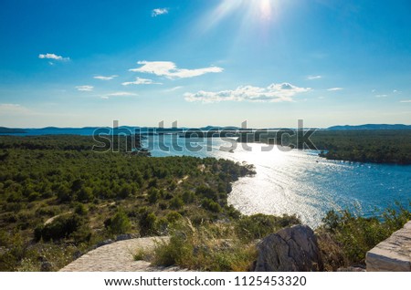 Channel of St Anthony, Sibenik, Croatia. Beautiful sunny day in Dalmatia, Nice outdoors and landscape photo of warm summer season at Adriatic Sea. Calm, peaceful and happy image.