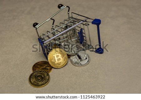  golden bitcoins and shopping trolley