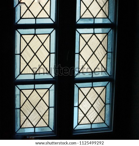 Decorative window with colored glass and geometric pattern