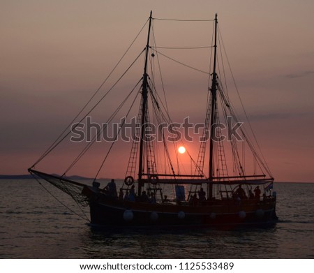 Sailboat at Sunset in Brac, Croatia. Scenic destination in the Adriatic Sea.