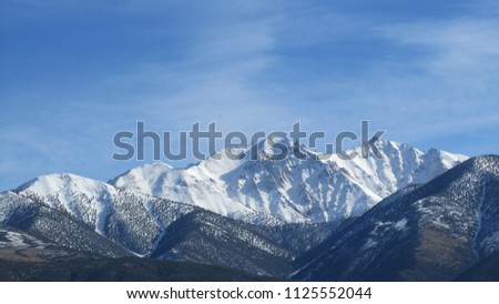 Mountian top with snow. Royalty-Free Stock Photo #1125552044