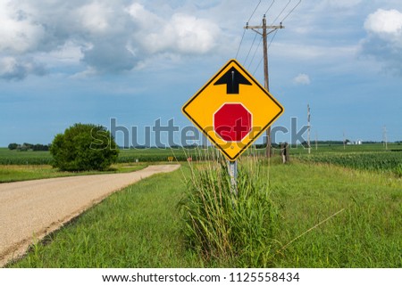 "Stop Sign Ahead" street sign on rural country road.