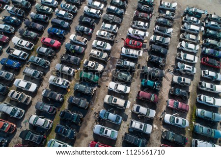 Aerial drone photo of an automotive junk yard Royalty-Free Stock Photo #1125561710