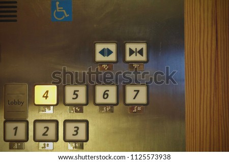 4th floor light on elevator buttons, and handicap sign or symbol for disabled persons use comfortable 