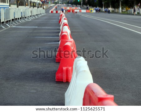 plastic road fencing on the street of a modern city