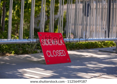 Sidewalk closed sign with copyspace and bars