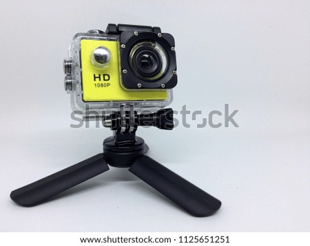 Action camera with underwater case and mini tripod