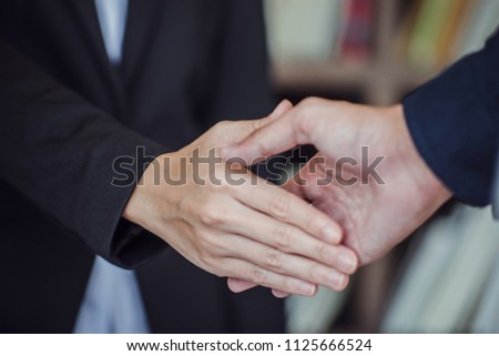 businessman shaking hands during a meeting in the office ,finishing up meeting. Successful businessman