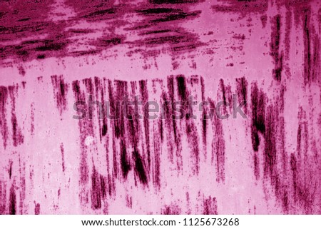Grungy rusted metal surface in pink tone. Abstract background and texture.