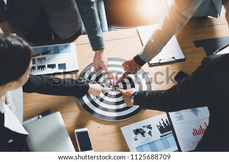 Businesspeople Point to a darts aiming at the target center business,Targeting the business concept. Royalty-Free Stock Photo #1125688709