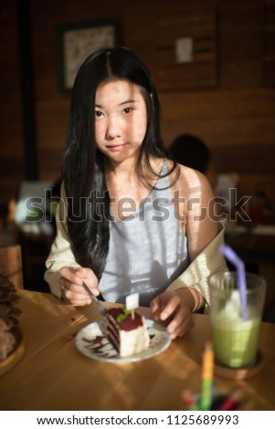 Happy cute asian girl enjoying her winter holiday time