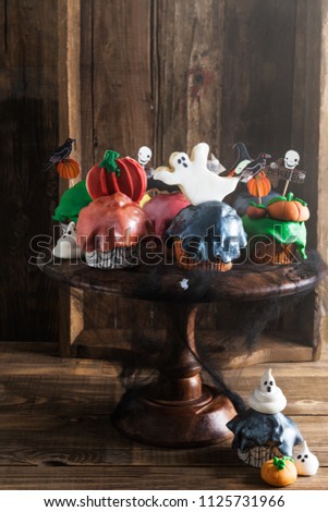 Table Set for Halloween Dinner with Scary Cupcakes and Cookies