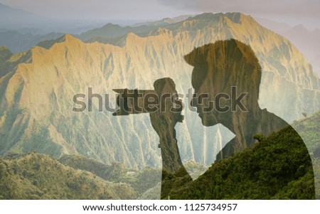 Landscape travel photography concept. Man photographing against a mountain background. Mountain location Hawaii. 