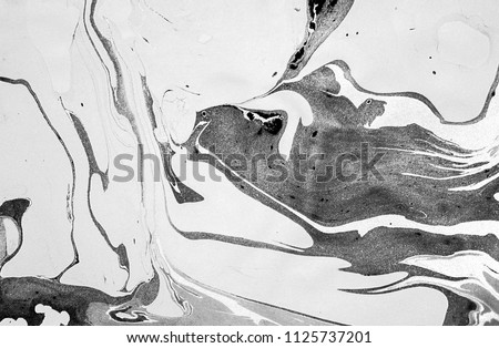 Suminagashi – the ancient art of Japanese marbling. Paper marbling is a method of aqueous surface design, which can produce patterns similar to smooth marble or other kinds of stone. Natural luxury. Royalty-Free Stock Photo #1125737201