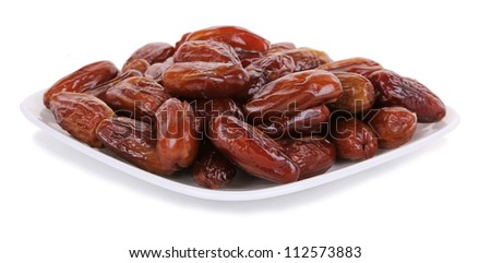 Fresh dates on white plate isolated on white background