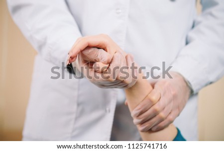 Doctor holding girl's hand