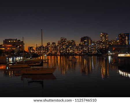 Twilight at Vancouver city with reflection of skyscrapers, British Columbia, Canada. 