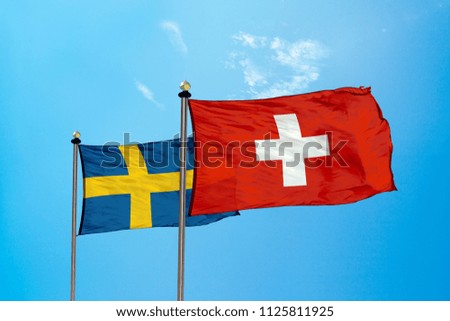 Switzerland and Sweden flag on the mast