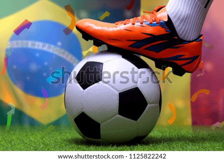 Close up legs and feet of soccer player or football player walk on green grass ready to play match on national Brazil and national Belgium.