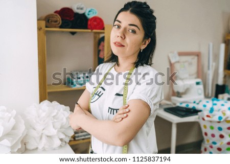 Young Fashion designer working in studio