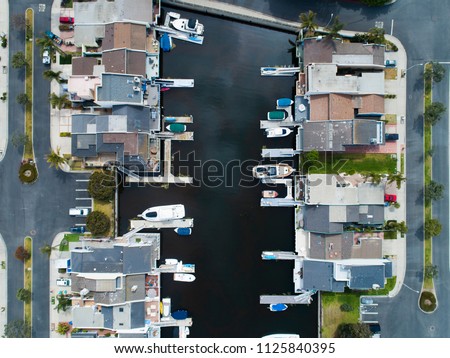 Aerial view of a resort town in the waterside.House with private boat.