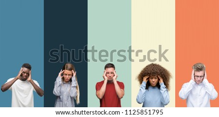 Group of people over vintage colors background with hand on head for pain in head because stress. Suffering migraine. Royalty-Free Stock Photo #1125851795