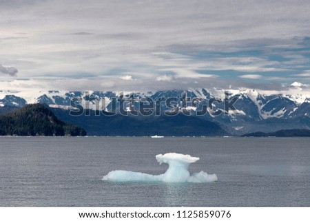 Prince William Sound, Alaska, USA – September 1, 2010:  Panoramic view of an ice block of the Columbia Glacier floating in the Sound