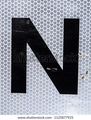 Written Wording in Distressed State Typography Found Letter N