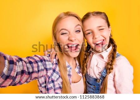Follow me on social network! I want like! Close up photo picture portrait of candid careless pretty joyful funny funky cheerful glad hugging embracing girls making selfie isolated on bright background