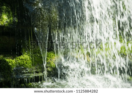 waterfall among stones