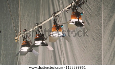 Big spotlight or lighting equipment for film movie or vdo shooting production in studio.