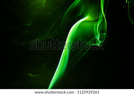 Abstract colored background. beautiful Light green smoke, ink in water, the patterns of the universe. Abstract movement, frozen multi color flow of paint. 
