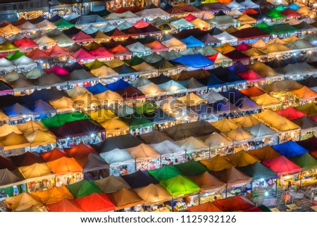Aerial view,Bangkok Train market secondhand market at sunset time. Bird eyes view of Multi-colored tents /Sales of second-hand market at twilight - Panorama picture  in Bangkok, Thailand